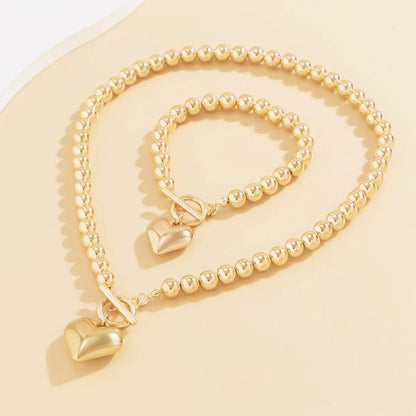 Set de Collar y Pulsera con Corazón de Cuentas